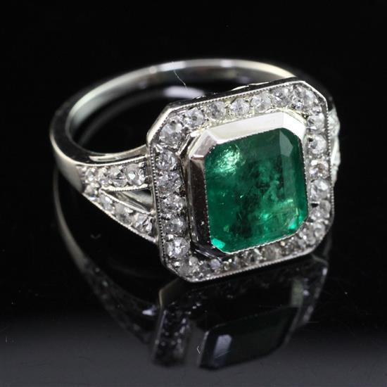 A white gold, emerald and diamond set octagonal ring, size M.